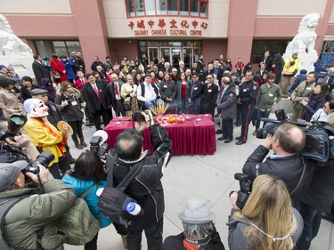 Dignitaries pose for a group photo during a Chinese New Year celebration outside of the Chinese Cultural Centre in downtown Calgary, Alta., on Sunday, Feb. 7, 2016. The Chinese community is celebrating the Year of the Monkey. Lyle Aspinall/Postmedia Network