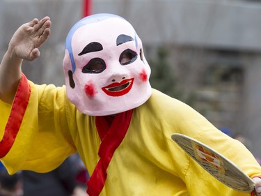 The Happy Buddhua strikes a pose before the Dragon Dance during a Chinese New Year celebration outside of the Chinese Cultural Centre in downtown Calgary, Alta., on Sunday, Feb. 7, 2016. The Chinese community is celebrating the Year of the Monkey. Lyle Aspinall/Postmedia Network
