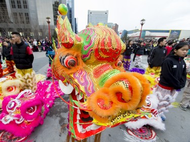 A dragon stands ready to dance during a Chinese New Year celebration outside of the Chinese Cultural Centre in downtown Calgary, Alta., on Sunday, Feb. 7, 2016. The Chinese community is celebrating the Year of the Monkey. Lyle Aspinall/Postmedia Network