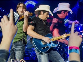 Country star Brad Paisley performs at the Scotiabank Saddledome in Calgary, Alta., on Thursday, Feb. 18, 2016. The show was part of Paisley's Crushin' It tour.