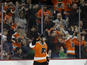 Philadelphia Flyers' Claude Giroux reacts after scoring a goal for his 500th career point during the first period against the Arizona Coyotes last Saturday.