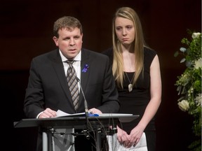Dad Jason Caldwell speaks near his daughter Katie Caldwell during the funeral for his sons Jordan and Evan Caldwell at Centre Street Church on Thursday, Feb. 11, 2016