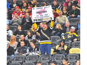 A fan of the Pittsburgh Penguins holds up a sign during a game against the Detroit Red Wings at Consol Energy Center on February 18, 2016 in Pittsburgh, Pennsylvania.