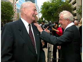 July 3, 2003. Left to right - Former Alberta premier Don Getty gets a hand on the shoulder from  former Alberta premier Peter Lougheed as they share  a lighter moment following the funeral for the late Provincial Treasurer and MLA  Dick Johnston at the All Saints Anglican Cathedral at 10035 103 St., on Thursday July 3, 2003 in Edmonton.