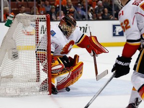 Jonas Hiller #1 of the Calgary Flames blocks a shot on goal during the first period of a game against the Anaheim Ducks at Honda Center on February 21, 2016 in Anaheim, California.  (Photo by Sean M. Haffey/Getty Images)