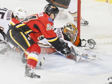 Jiri Hudler of the Calgary Flames scores a late second-period goal on Anaheim Ducks goalie Frederik Andersen near defender Sami Vatanen in Calgary, Alta., on Monday, Feb. 15, 2016. Lyle Aspinall/Postmedia Network