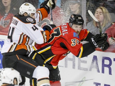 Cam Fowler of the Anaheim Ducks collides with Jakub Nakladal of the Calgary Flames in Calgary, Alta., on Monday, Feb. 15, 2016. Lyle Aspinall/Postmedia Network