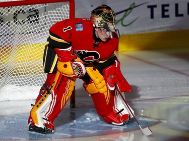 Calgary Flames goalie Jonas Hiller hits the ice before facing the Minnesota Wild in Calgary, Alta., on Wednesday, Feb. 17, 2016. Lyle Aspinall/Postmedia Network