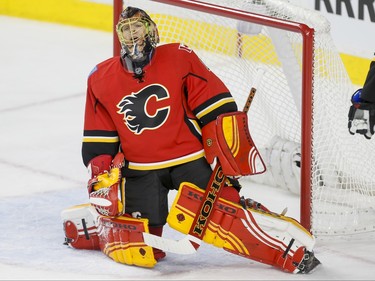 Calgary Flames goalie Jonas Hiller reacts after allowing a Minnesota Wild  goal in Calgary, Alta., on Wednesday, Feb. 17, 2016. Lyle Aspinall/Postmedia Network