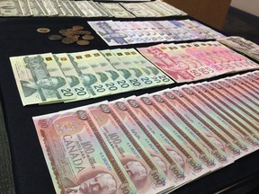 Calgary Police Service displayed counterfeit money and other tools of the fraud trade on Tuesday, March 1, 2016, to launch Fraud Prevention Month in the city.
