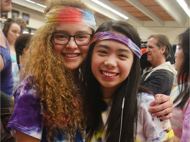 Lena Rojas, left, Princess Leia (she swears it's her real name) show off their tie dye spirit Grooving Into the Record Books at Bishop Grandin High School Friday February 26, 2016. The school broke the record for the largest number of people gathered together wearing tie dye shirts. (Ted Rhodes/Postmedia)