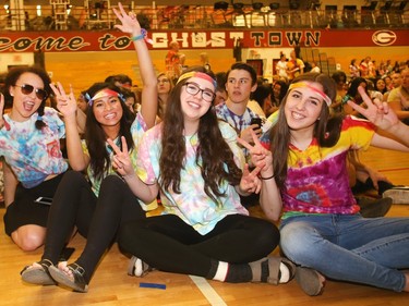 Grade 12 students at Bishop Grandin High School get into the tie dye spirit Grooving Into the Record Books in the school gym Friday February 26, 2016. Pictured from the left are, Meagan MacMillan, Cassie Haggerty, Marcelyn Buluran, Lauren Smith and Emily Wagner. The school broke the record for the largest number of people gathered together wearing tie dye shirts. (Ted Rhodes/Postmedia)