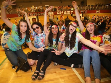 Grade 12 students at Bishop Grandin High School get into the tie dye spirit Grooving Into the Record Books in the school gym Friday February 26, 2016. Pictured from the left are, Meagan MacMillan, Cassie Haggerty, Marcelyn Buluran, Lauren Smith and Emily Wagner. The school broke the record for the largest number of people gathered together wearing tie dye shirts. (Ted Rhodes/Postmedia)