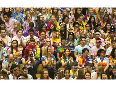 A gym full of students and staff at Bishop Grandin High School get into the tie dye spirit Grooving Into the Record Books in the school gym Friday February 26, 2016. The school broke the record for the largest number of people gathered together wearing tie-dye shirts.