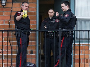 Calgary police outside the Red Carpet Inn and Suites.