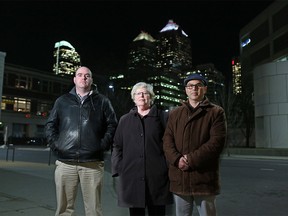 From left; Daniel Lenfest-Jameson, Betsy Jameson and Jonathan Zito with Temple B'nai Tikvah stand outside Hotel Arts after they and other church representatives were upset to hear that Inn from the Cold was ending the Community Inn program. The program had Calgary churches offering temporary shelter to the homeless.  (Gavin Young/Postmedia)