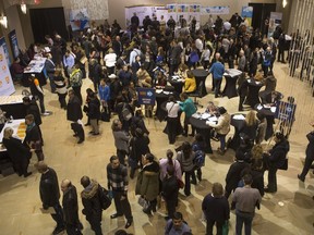 Hundreds of people  attend the Hire 10 job fair at the Metropolitan Centre in Calgary on Dec. 17, 2015.