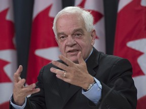 Immigration Minister John McCallum updates the media on the Syrian refugees arriving in Canada, during a news conference, Wednesday, Feb. 3, 2016 in Ottawa.