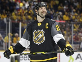 Pacific Division forward John Scott looks into the stands during the NHL hockey All-Star championship game against the Atlantic Division.