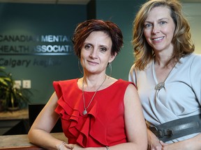 Joy Pavelich with the Canadian Mental Health Association, left, pictured in November 2014. (Crystal Schick/Calgary Herald)