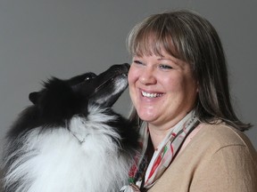 Karen Linkletter enjoys a moment with her Shetland Sheepdog Blackberry.