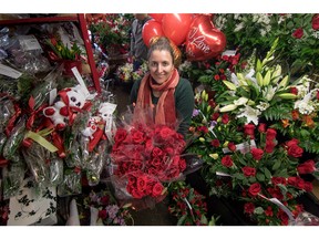 Manager Janna Brunnen surrounded by Valentine's Day bouquets at Red Rose Florist in Calgary, Ab., on Saturday February 13, 2016. Mike Drew/Postmedia