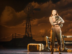 Sarah Lasko as Dorothy and Nigel as Toto in Over The Rainbow in Broadway Across Canada's Wizard of Oz.