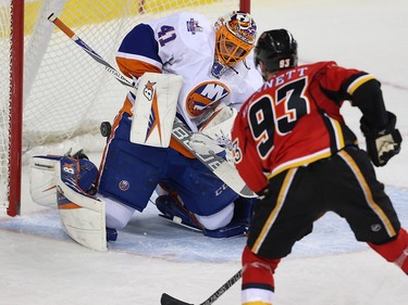 New York Islanders Jaroslav Halak makes a save on a shot by Sam Bennett during NHL hockey in Calgary, Alta., on Thursday, February 25, 2016.