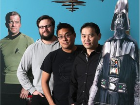 Eric Sit, right, president of Epic Photo Ops, with his executive team, Kandrix Foong, centre, and Brant LeClercq, along with images of Darth Vader and Captain Kirk, at their Ogden Road storefront.