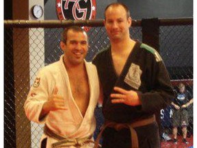 Wyatt Lewis, right, in an  undated photo with his jujitsu coach Anderson Goncalves.