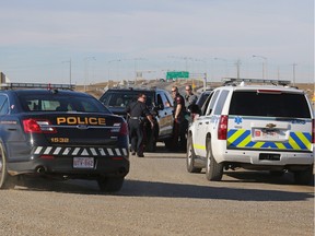 Police close down 84th Street in northeast Calgary while they investigate a nearby property where loaded weapons were on found on Tuesday, Feb. 9, 2016.