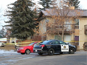 Police guard a scene in the 400 block of Ranchlands Grove N.W. on Monday February 1, 2016.