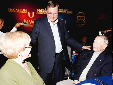 August, 24 2011: Premier Ed Stelmach speaks with former premier Don Getty and his wife  Margaret during Premier Stelmach's farewell party at the Northlands Expo Centre.