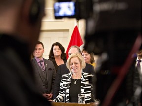 Premier Rachel Notley speaks to the media after the swearing in of new cabinet ministers in Edmonton.