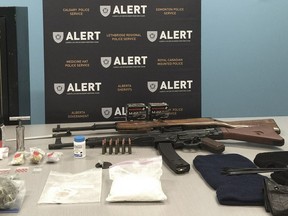 Seven people were arrested and charged after firearms, ammunition and $40,000 worth of drugs were seized from two Medicine Hat homes on Feb. 13, 2016.