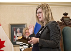 Alberta Minister Responsible for Democratic Renewal and Minister of Service Alberta, Stephanie McLean is sworn in as a new cabinet minister in Edmonton on Monday, Feb. 2, 2016.