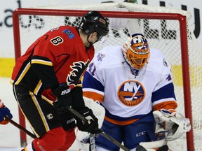 Islanders goalie Jaroslav Halak makes a save on  Flames forward  Joe Colborne during game on Thursday.