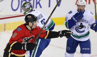 Calgary Flames Johnny Gaudreau lets a shot go against Eddie Lack of the Carolina Hurricanes during NHL hockey in Calgary, Alta., on Wednesday, February 3, 2016. Al Charest/Postmedia