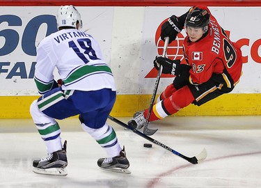 Calgary Flames Sam Bennett battles against Jake Virtanen of the Vancouver Canucks during NHL hockey in Calgary, Alta., on Friday, February 19, 2016. Al Charest/Postmedia
