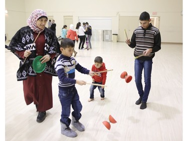 Syrian refugee children play with circus toys at a rec-centre in Calgary on Tuesday February 23, 2016.