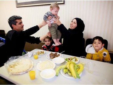 Syrian Refugee families gather in a hotel to eat ethnic food during their first weeks in Calgary.