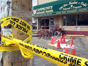 Crime scene tape seals the front parking lot of Community Natural Foods on 10th Avenue SW  on Tuesday April 23, 2013.