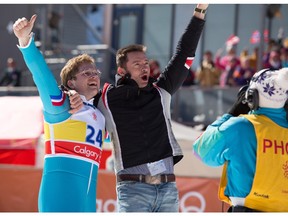 Taron Egerton, left, and Hugh Jackman appear in a scene from  Eddie the Eagle.
