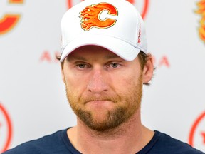 Calgary Flames defence man Dennis Wideman speaks with media after a practice in Calgary on Thursday, Feb. 4, 2016. It was his first time skating with the team since being handed a 20-game suspension for cross-checking linesman Don Henderson.