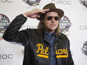 Arcade Fire's Win Butler arrives on the red carpet ahead of the NBA celebrity all-star game in Toronto on Friday February 12, 2016. Butler and his band will receive the 2016 Allan Waters Humanitarian Award at this year's Juno Awards being held in Calgary.