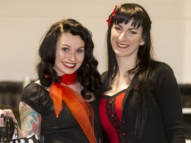 Kacie Phillips (L) poses for a photo with  organizer Debbie Shipley after winning the Pin-Up Girl Contest during the World of Wheels show at the BMO Centre in Calgary, Alta., on Sunday, Feb. 21, 2016. The popular auto-enthusiast show was in its 50th year. Lyle Aspinall/Postmedia Network