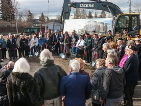 Members of the public join dignitaries from Truman Homes, Councillor Druh Farrell, Veterans Affairs Minister Kent Hehr and others at the sod-turning ceremony.