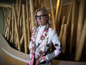 Former WestJet flight attendant Mandalena Lewis stands for a photograph in Vancouver, B.C., on Tuesday March 8, 2016. Lewis, fired after reporting an alleged sexual assault by one of the airline's pilots, says she is shocked at the positive response she's received since sharing her story publicly.THE CANADIAN PRESS/Darryl Dyck ORG XMIT: VCRD201