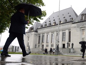 The Supreme Court of Canada building is pictured, in Ottawa, on October 15, 2014. The Trudeau government appears to be in no hurry to grapple with the explosive issue of doctor-assisted dying, even as it prepares to urge the Supreme Court to give it more time to craft a new law on the matter. THE CANADIAN PRESS/Sean Kilpatrick ORG XMIT: CPT101
