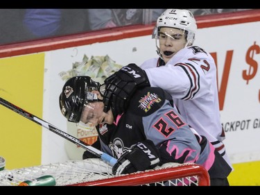 Calgary Hitmen Andrew Fyten gets roughed up after the whistle by Red Deer Rebels Brandon Hagel in WHL action at the Scotiabank Saddledome in Calgary, Alberta, on Sunday, March 6, Mike Drew/Postmedia